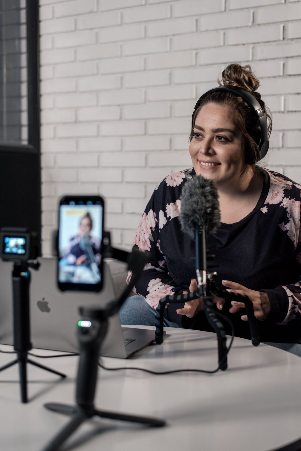 A young creator recording a video podcast with microphone and camera